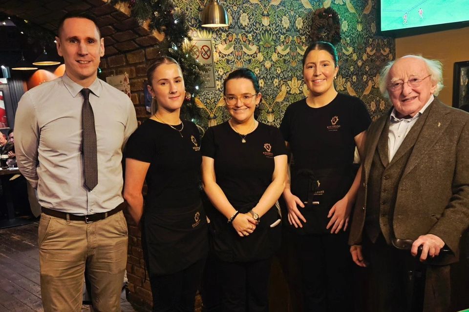Michael D Higgins pictured with staff at Kelehan's Bar PIC CREDIT: Kelehan's Bar/Facebook